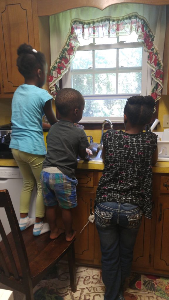 Kids doing chores working homeschooling mom